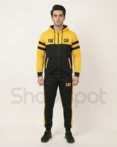 Yellow and black tracksuit with 'CAT' branding