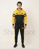 Yellow and black tracksuit with 'CAT' branding