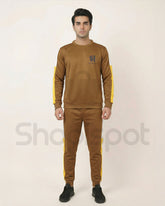 Brown tracksuit with yellow stripes