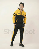 Yellow and black tracksuit with 'CAT' branding