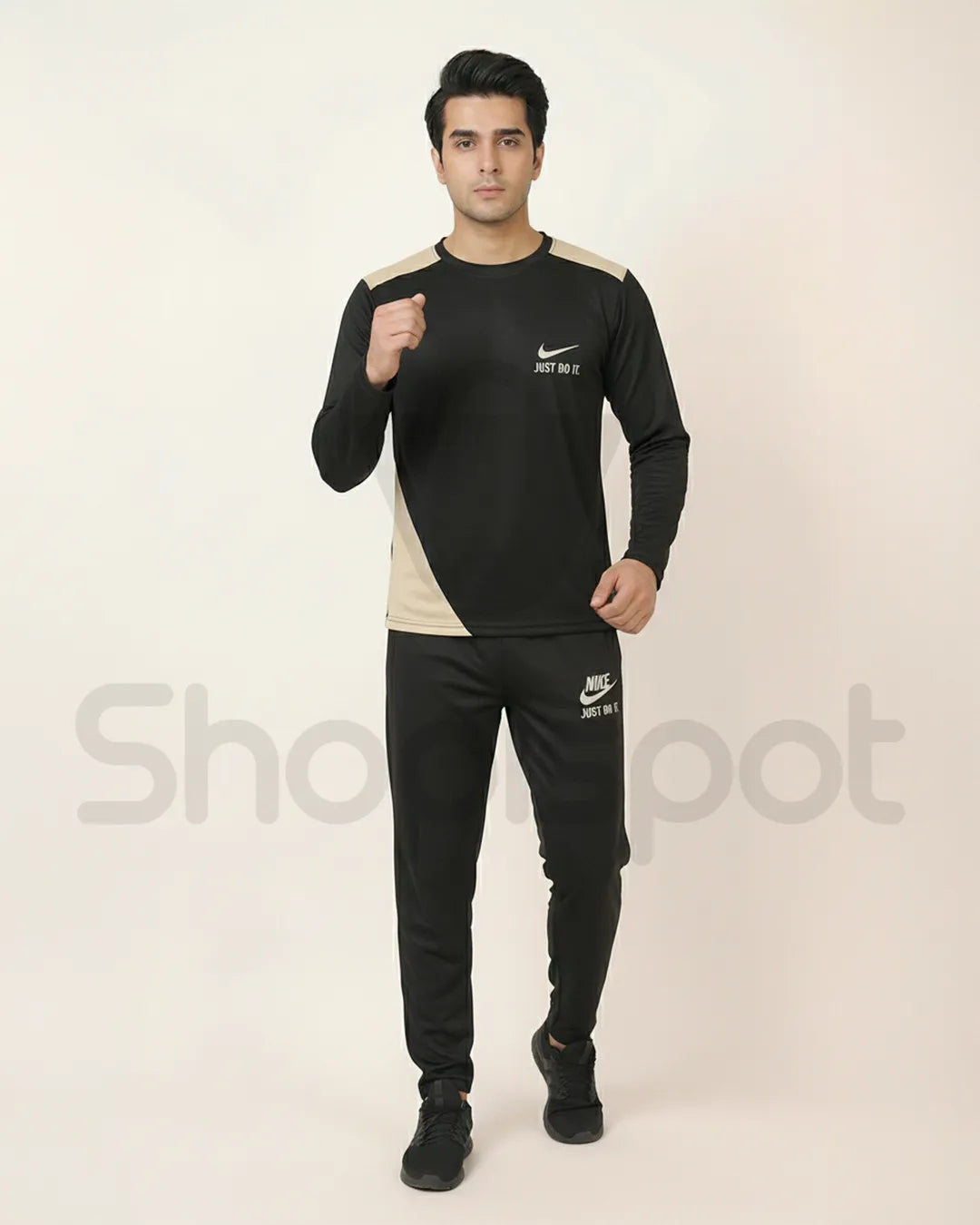 Black Nike tracksuit with white accents