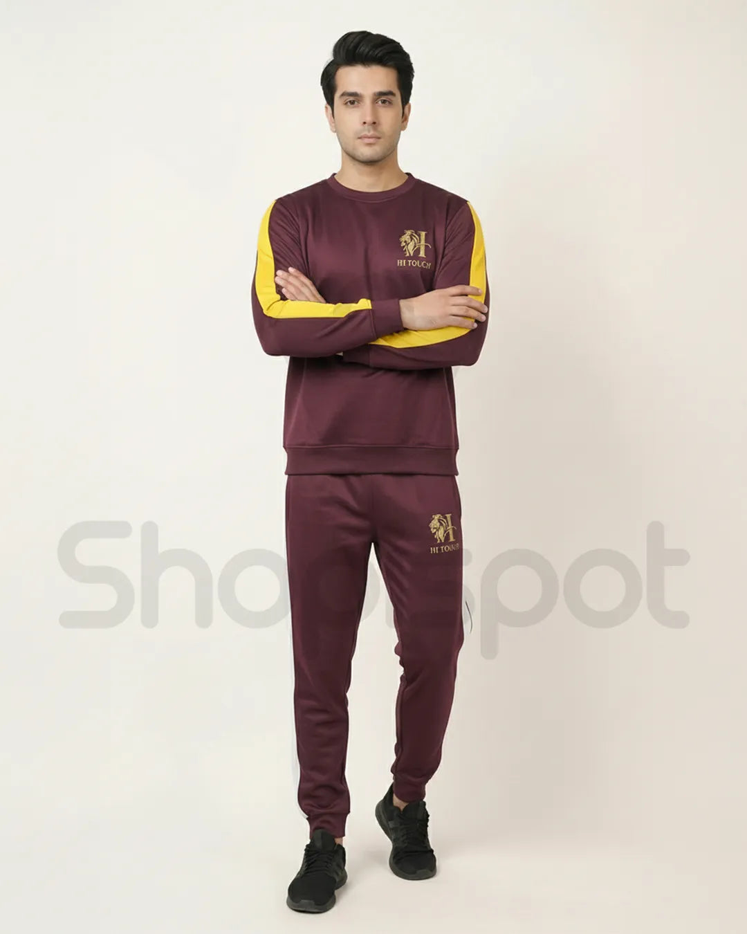 Maroon tracksuit with yellow and white accents