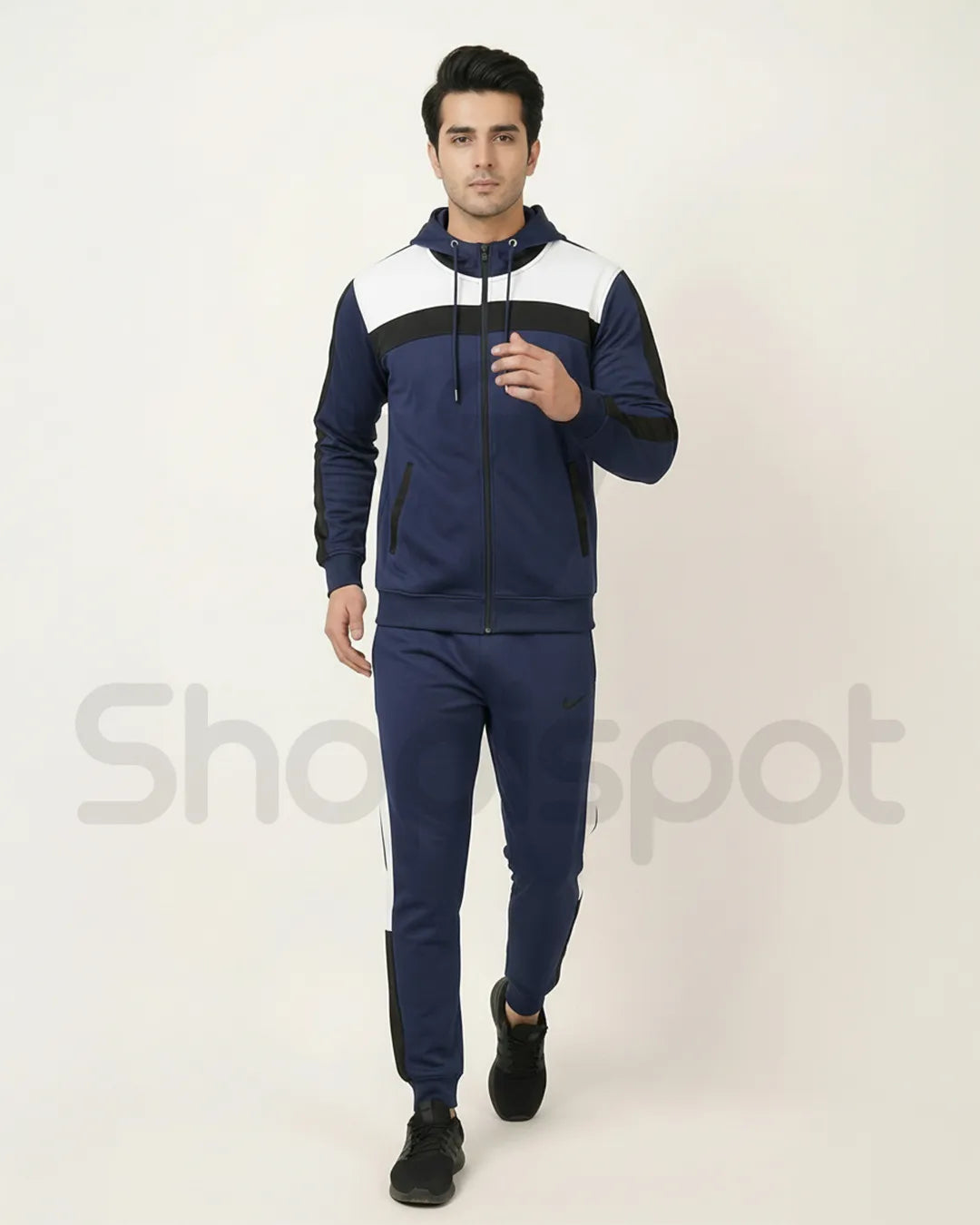 Navy and white tracksuit with a Nike tag