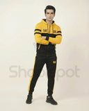 Yellow and black tracksuit with 'CAT' branding