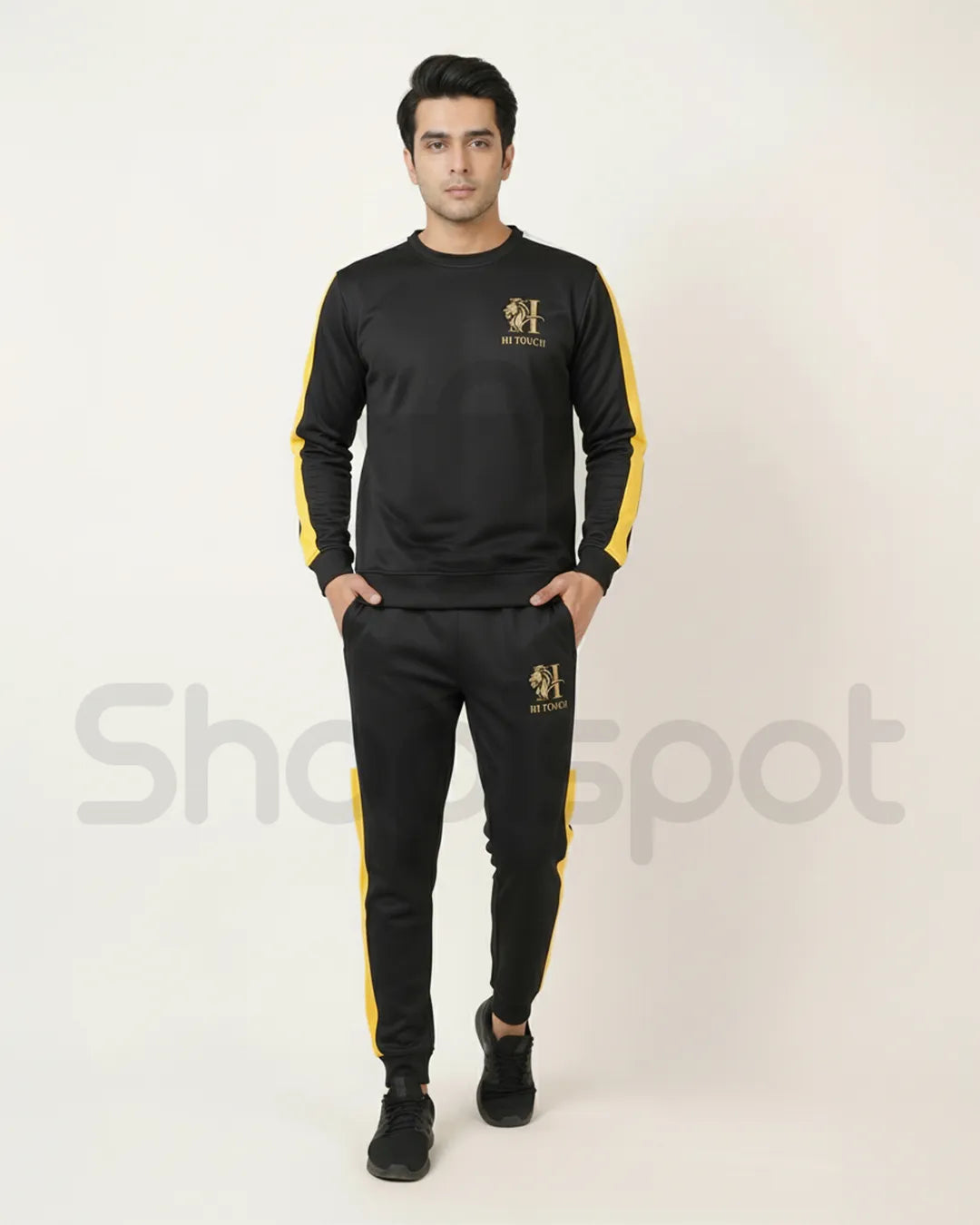 Black and yellow tracksuit with brand logo