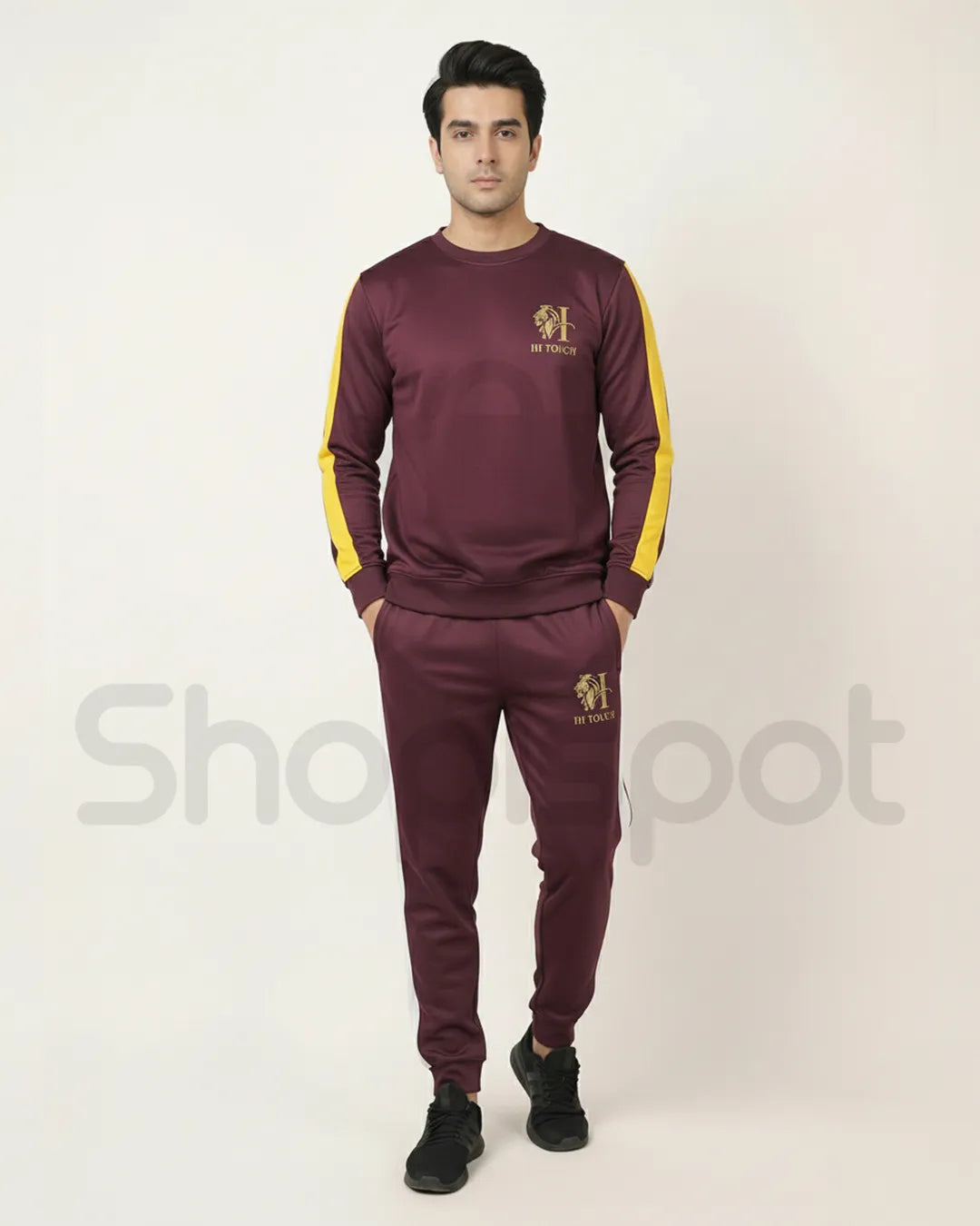 Maroon tracksuit with yellow and white accents