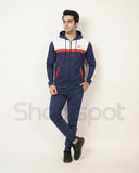 Navy tracksuit with red and white accents