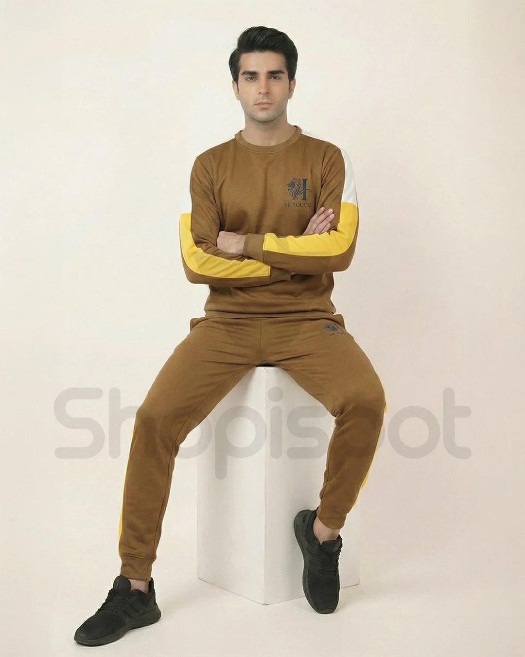 Brown tracksuit with yellow stripes