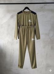 Green tracksuit with Nike logo on a gray background