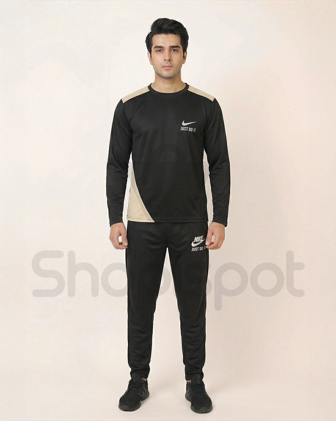 Black Nike tracksuit with white accents