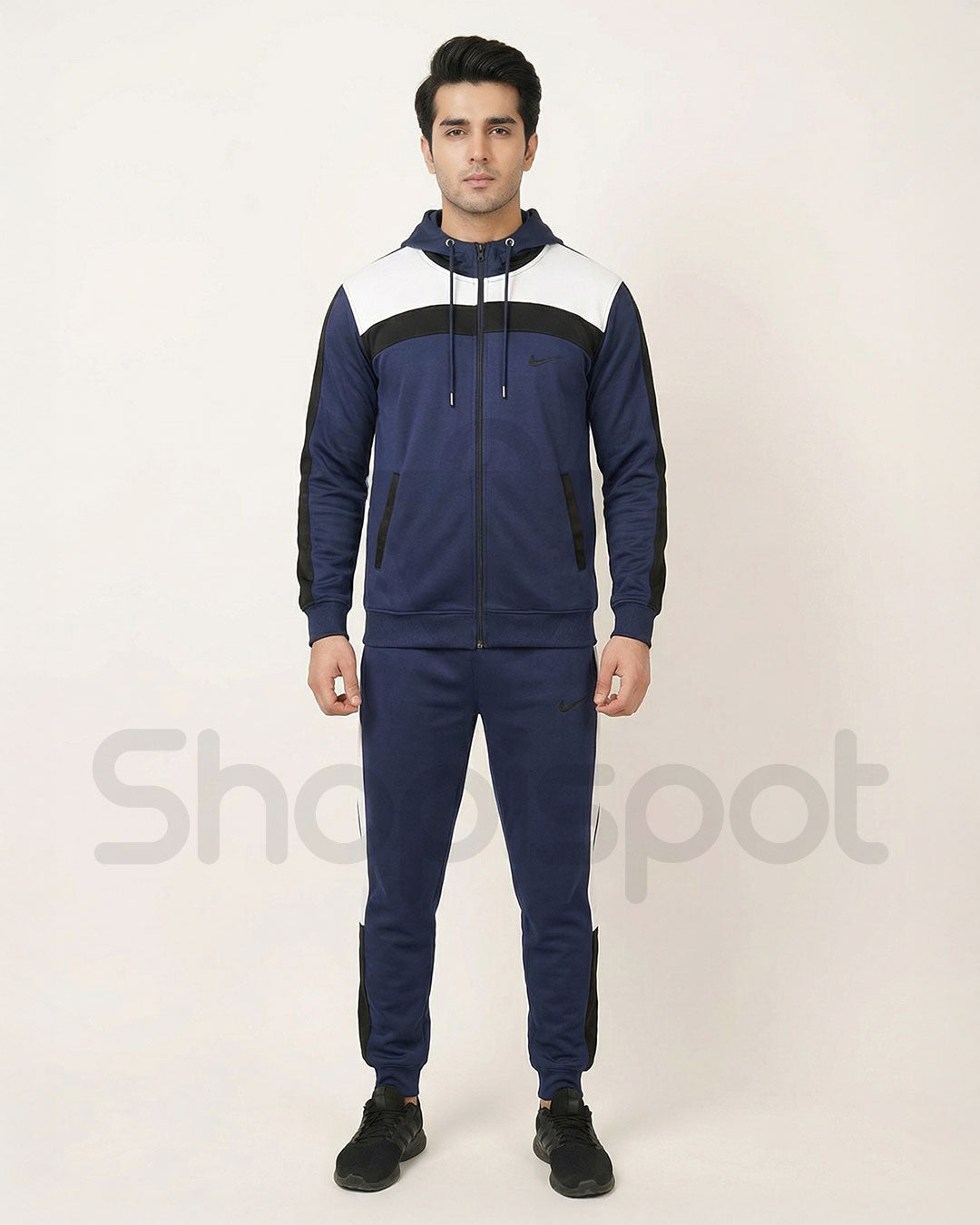 Navy and white tracksuit with a Nike tag