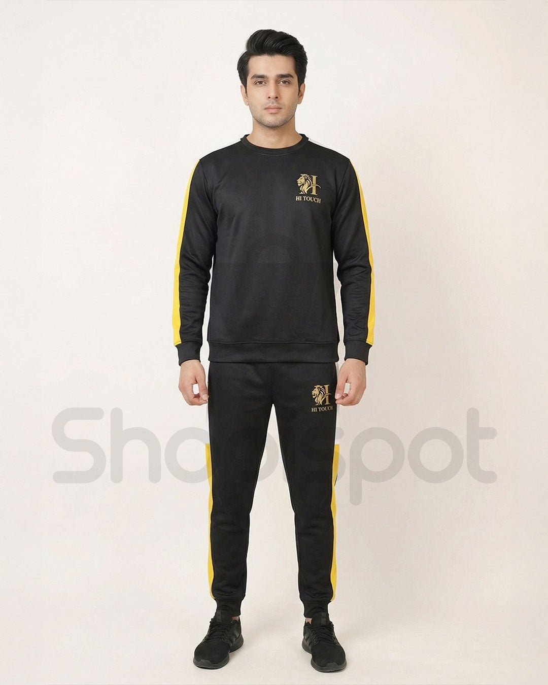 Black and yellow tracksuit with brand logo