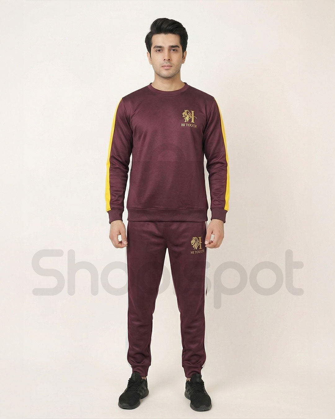 Maroon tracksuit with yellow and white accents